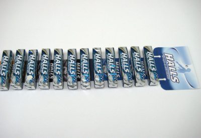 Colgador tira adhesiva caramelos